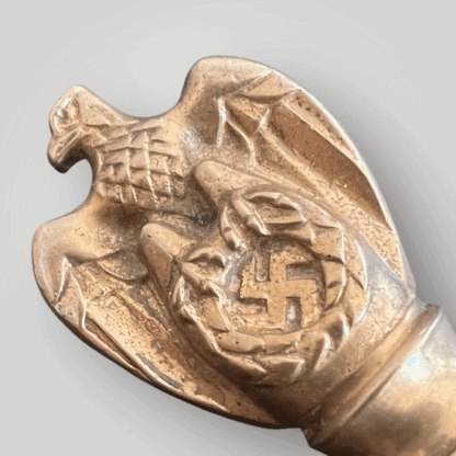 A German WW2 Kriegsmarine officers dagger pommel with an eagle clutching a swastika by Carl Eickhorn.