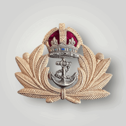 An original British WW2 Royal Navy Officers cap badge, constructed ub brass and white metal with felt backing.