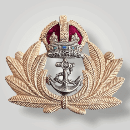 An original British WW2 Royal Navy Officers cap badge, constructed ub brass and white metal with felt backing.