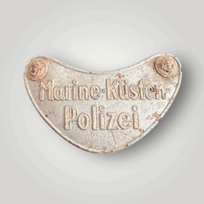 This is a rare German WW2 Marine-Küstenpolizei gorget, manufactured from zinc. Distinct from standard gorgets, it was designed to be worn below the breast eagle rather than suspended on a chain around the neck.