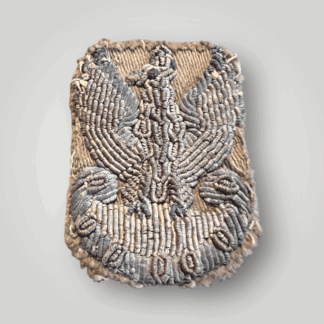 A rare Free Polish WW2 Officers bullion cap badge, hand embroidered in silver bullion on Khaki backing.