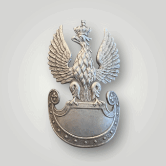 A Free Polish Forces (Army In Exile) cap badge, worn by enlisted men/ncos constructed in white metal. The badge illustrates the National Crowned Eagle with spread wings perched on heraldic sheild.