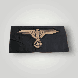 A German Waffen-SS Tropical BeVo Sleeve Badge, flat wire BeVo construction in tan coloured thread on a black background.