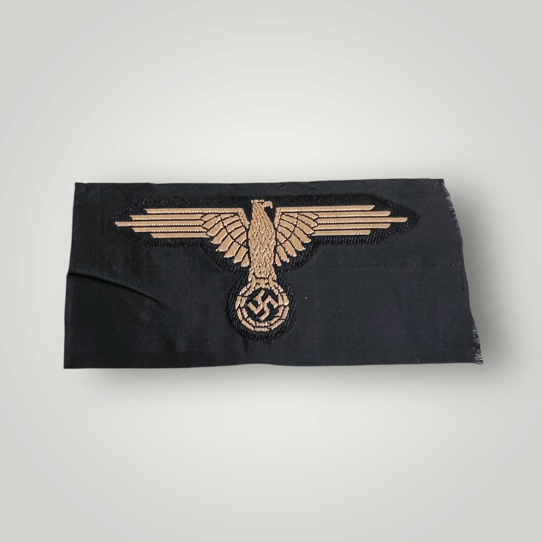 A German Waffen-SS Tropical BeVo Sleeve Badge, flat wire BeVo construction in tan coloured thread on a black background.