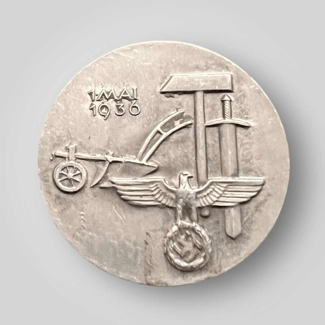 This is an original Third Reich 1st May 1936 National Labour Day Badge, manufactured as a solid piece in aluminium.
