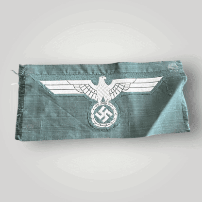 An original German WW2 Heer (Army) M38 Bevo breast eagle, flat weave BeVo construction on field green backing.