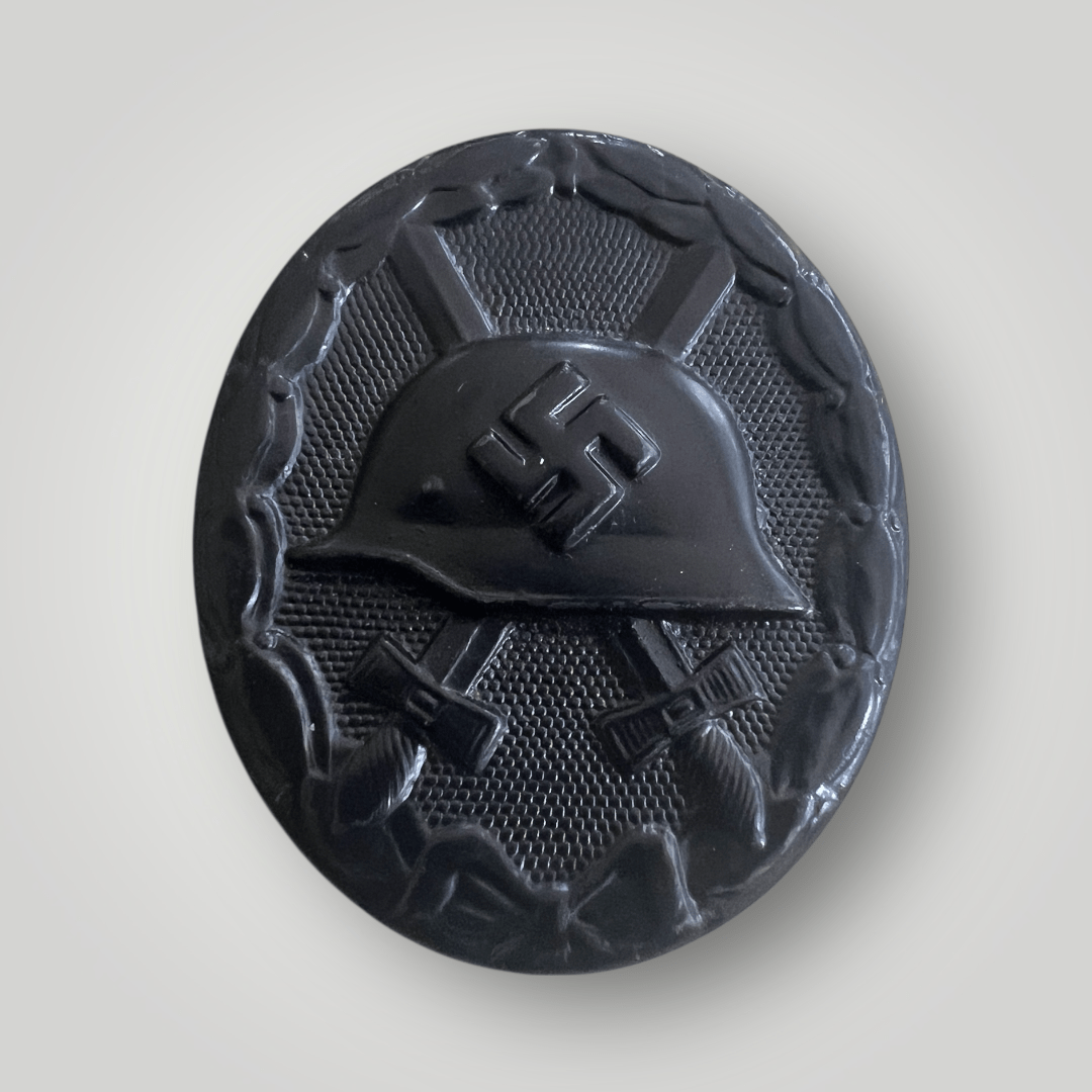 An original German WW2 Wound Badge in Black by Carl Wild. The badge is die-stamped from steel and retains factory paint finish.
