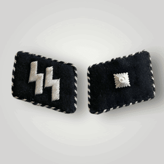 A rare set of SS Leibstandarte Adolf Hitler collar tabs for Unterscharführer. The right displays the inconic ss runes and the right one single pip denoting the rank. Both embroidered in silver bullion wire on fine black wool base.