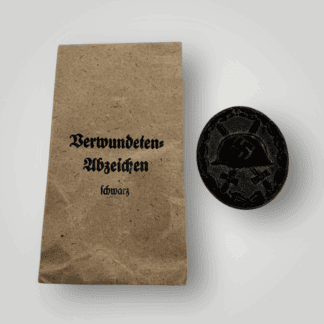 An original German Wound Badge Black 1939 by Hermann Wernstein, die-stamped construction in tobak hollow back