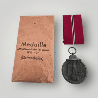 An Eastern Front Medal by J.E. Hammer & Söhne, constructed in zinc complete with ribbon and presentation packet.
