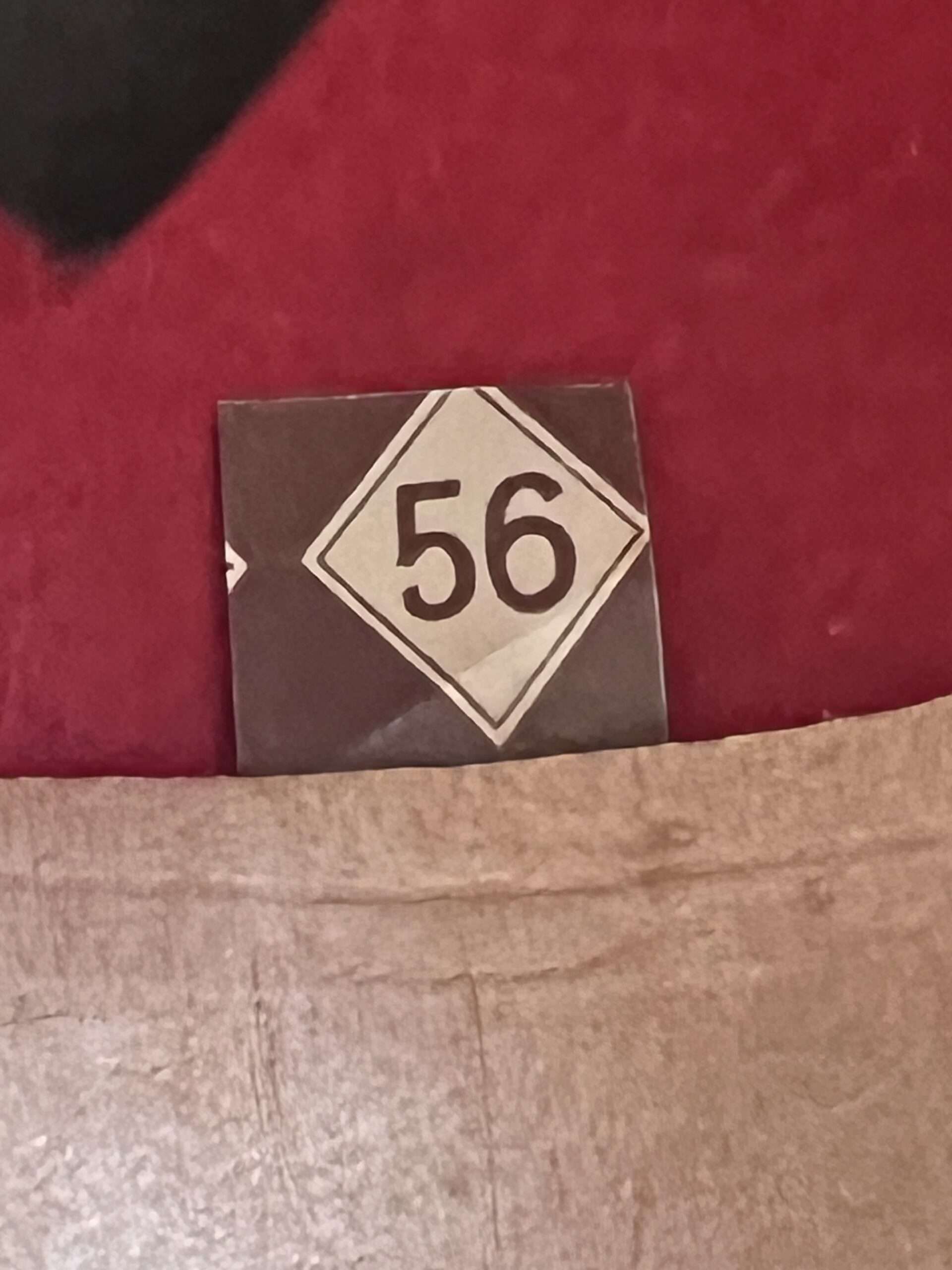 Interior photo of a Heer Afrikakorp Pith Helmet 2nd Pattern, with size tag 56.