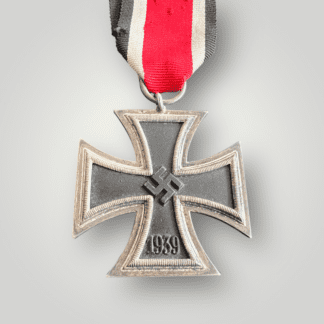 An original German WW2 Iron Cross 1939 2nd Class Medal, two-part construction with a magnetic iron core with nice factory paint finish. The suspension ring is unmarked with nice orginal ribbon.