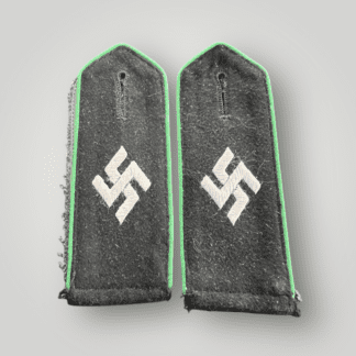 A rare set of Schutzmannschaft EM/NCOs shoulder boards, constructed in black wool with a embroidered swatiska in the centre in silver grey thread with apple green pipping.