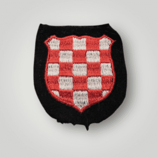 An original Croatian SS Volunteer sleeve shield, machine embroidered on black wool backin g with red and white thread.