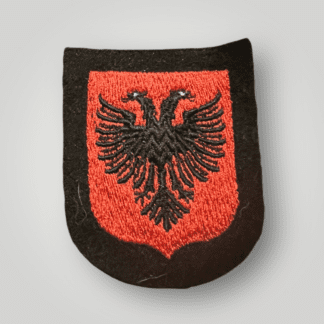 An original SS Albanian volunteers arm shield, machine embroidered in red and black thread depicting the Albanian eagle.