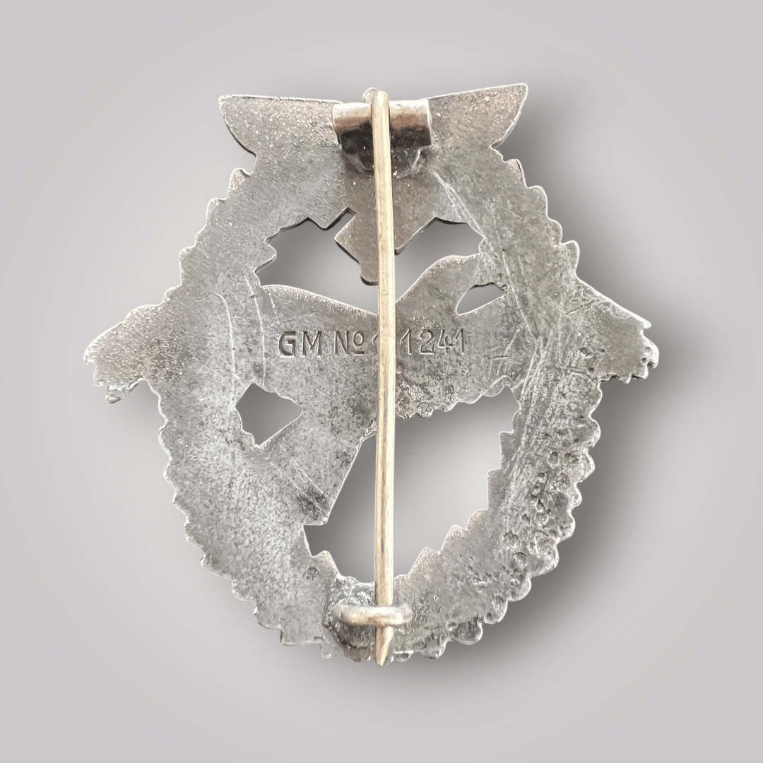 Reverse image of a NSFK Powered Aircraft Pilot Badge 3rd Pattern (National Socialist Flyers Corps), constructed from zinc.