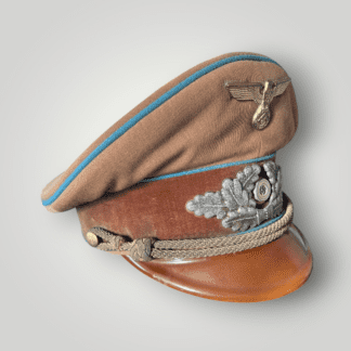 This is an original NSDAP Political Leaders visor cap for Ortsgruppenleiter, made from light tan brown fabric with a dark brown velvet central band and blue piping to indicate local group leadership. The eagle insignia has nice gold finish and attractive enamel on the political cockade.