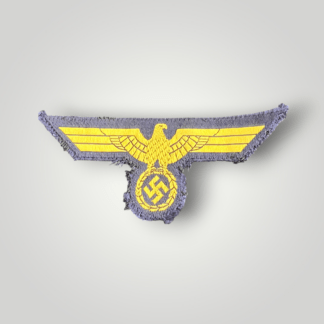 A standard M38 Kriegsmarine BeVo breast eagle for EM and NCOs, flat BeVo weave construction in gold on blue backing.