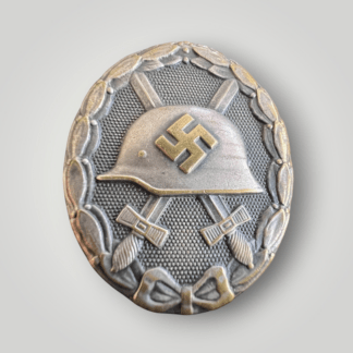 A mid to late war German WW2 Wound Badge Silver by Hauptmünzamt, solid construction in tomak with silver finish with nice patina.