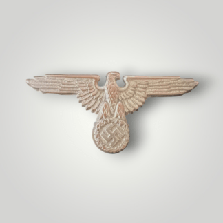 This is a rare SS Cap Eagle by Zimmermann, manufactured from silvered cupal and die-struck. The insignia is a type 1 variant and measures 68mm in width and 32mm in height. The reverse of the badge bears the left wing is stamped M1/72 for Fritz Zimmermann and the right wing is stamped with the RZM mark