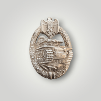 An original late war German WW2 Panzer Assault Badge Bronze, semi-hollow construction in zink, unmarked known as the "daisy variant" due to the flower in the foreground beneath the tracks.