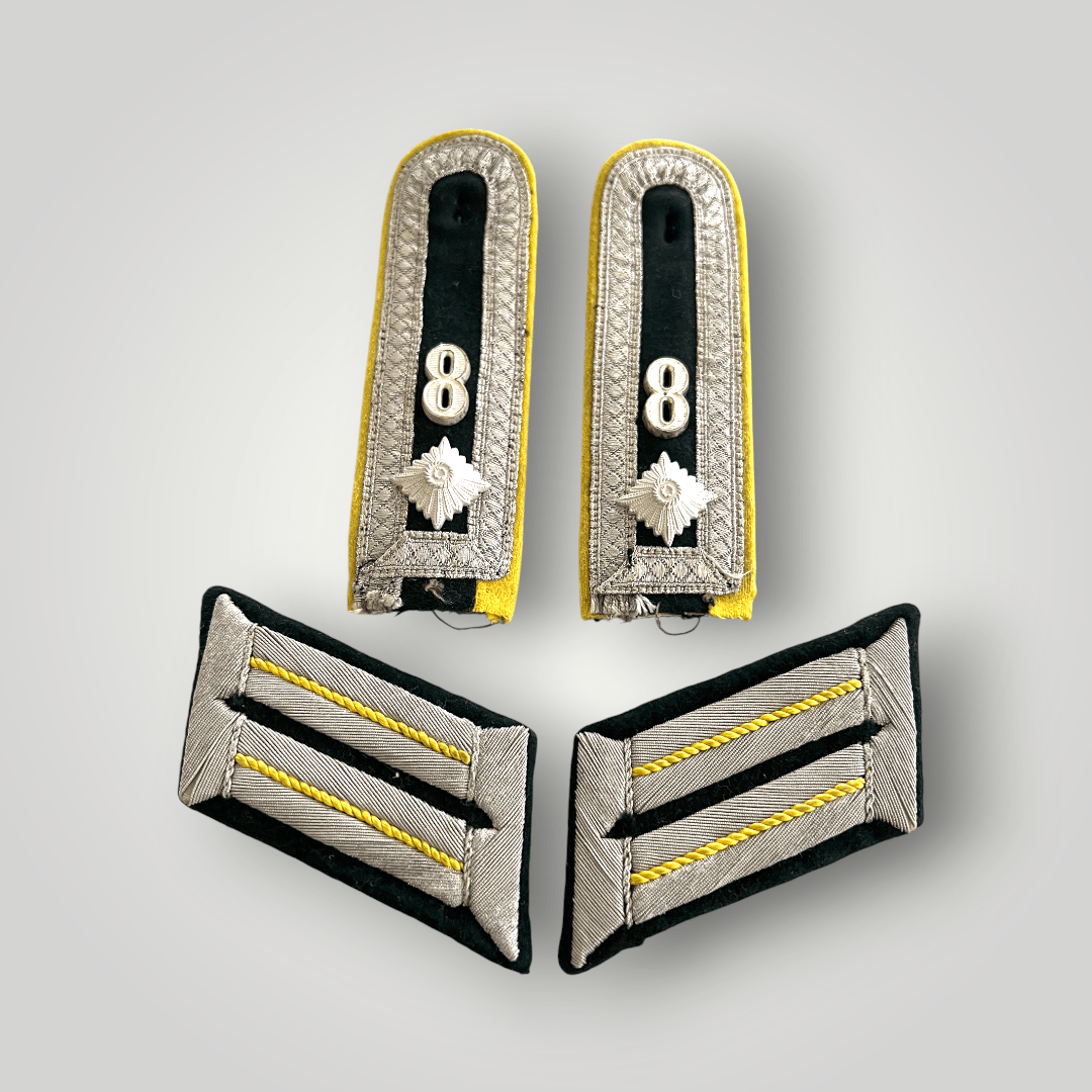 An original Heer 8th Infantry Division Signals Battalion insignia group. The group includes a set of M36 shoulder boards and officers collar boards.