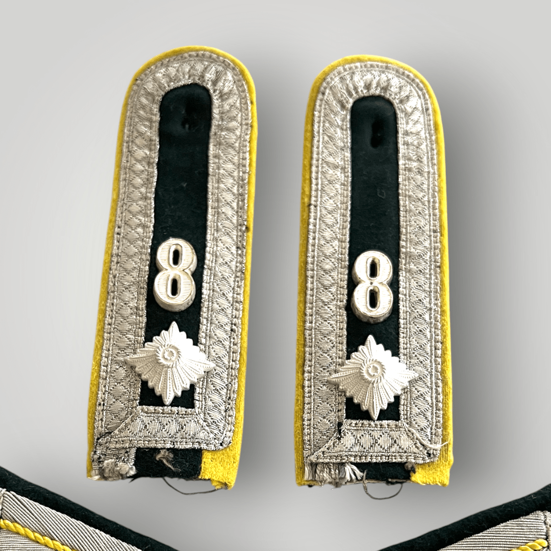 An original Heer 8th Infantry Division Signals Battalion insignia group. The group includes a set of M36 shoulder boards and officers collar boards.