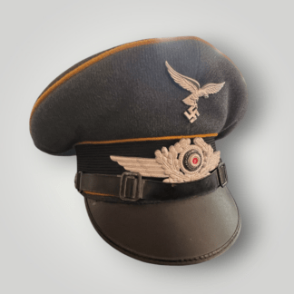 An original NSDAP Long Service Medal 10 Years with presentation box, constructed in zinc with original ribbon. The obverse of the medal has a beautiful bronze finish with nice patina, and the suspension ring is unmarked.