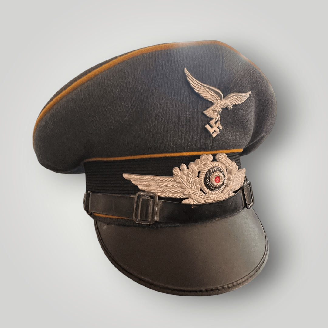 An original NSDAP Long Service Medal 10 Years with presentation box, constructed in zinc with original ribbon. The obverse of the medal has a beautiful bronze finish with nice patina, and the suspension ring is unmarked.