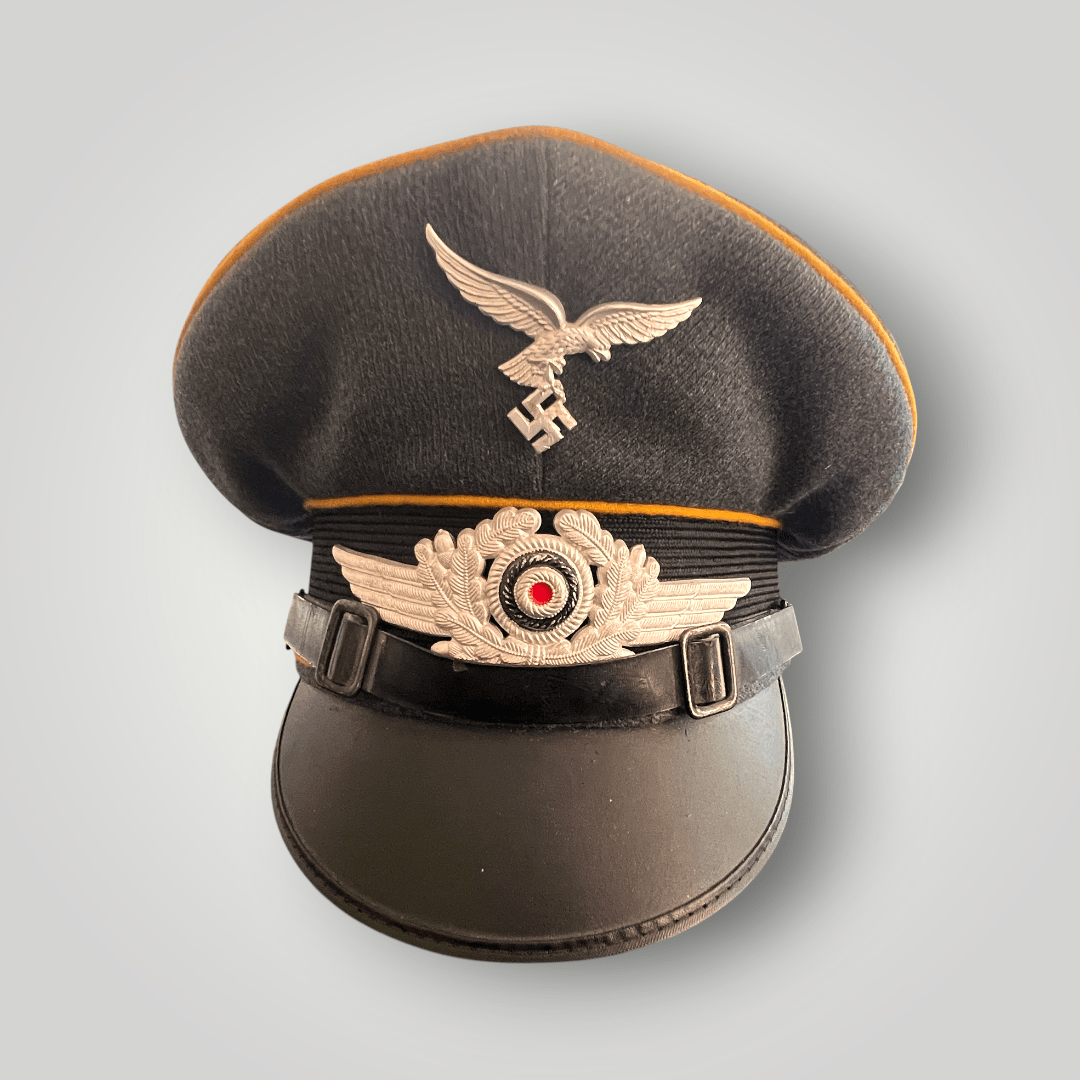 An original NSDAP Long Service Medal 10 Years with presentation box, constructed in zinc with original ribbon. The obverse of the medal has a beautiful bronze finish with nice patina, and the suspension ring is unmarked.