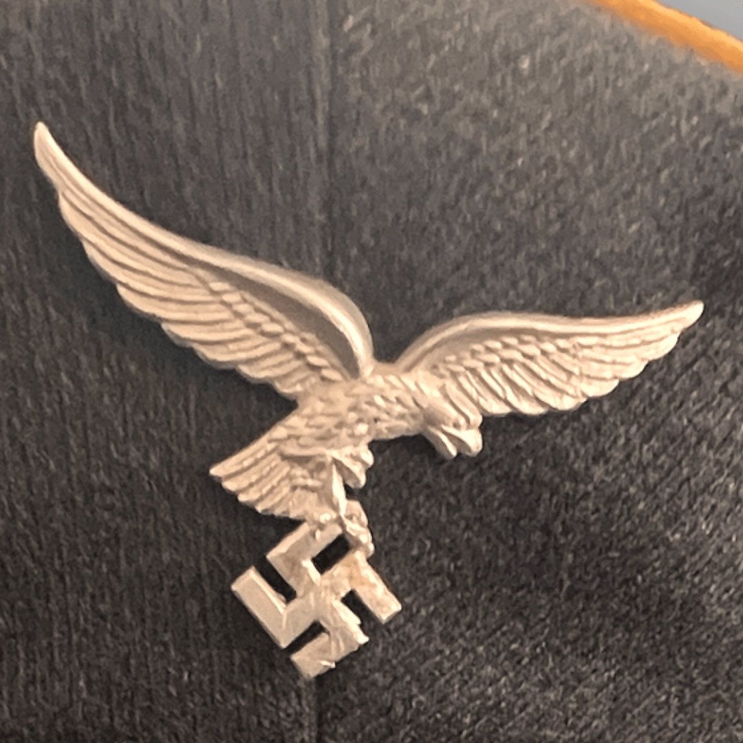 An original NSDAP Long Service Medal 10 Years with presentation box, constructed in zinc with original ribbon. The obverse of the medal has a beautiful bronze finish with nice patina, and the suspension ring is unmarked.