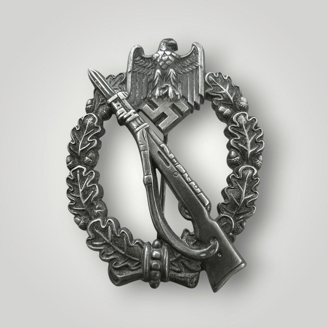 An Infantry Assault Badge Silver by Gottlieb & Wagner, constructed in zinc. The reverse of the decoration is unmark, however, the hinge and catch are crimped attributed to the maker Gottlieb & Wagner, Idar-Oberstein.