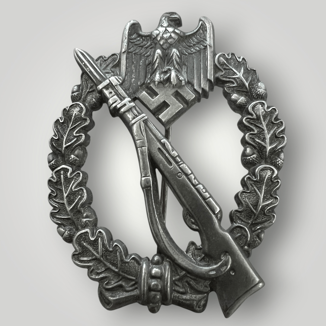 An Infantry Assault Badge Silver by Gottlieb & Wagner, constructed in zinc. The reverse of the decoration is unmark, however, the hinge and catch are crimped attributed to the maker Gottlieb & Wagner, Idar-Oberstein.