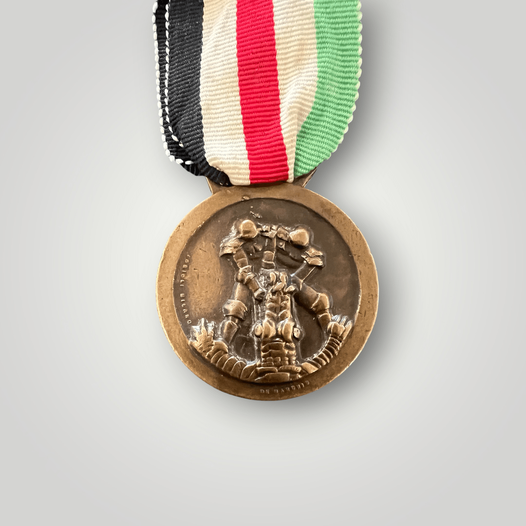 An original WW2 German German Italian Campaign Medal in bronze, complete with the original ribbon.