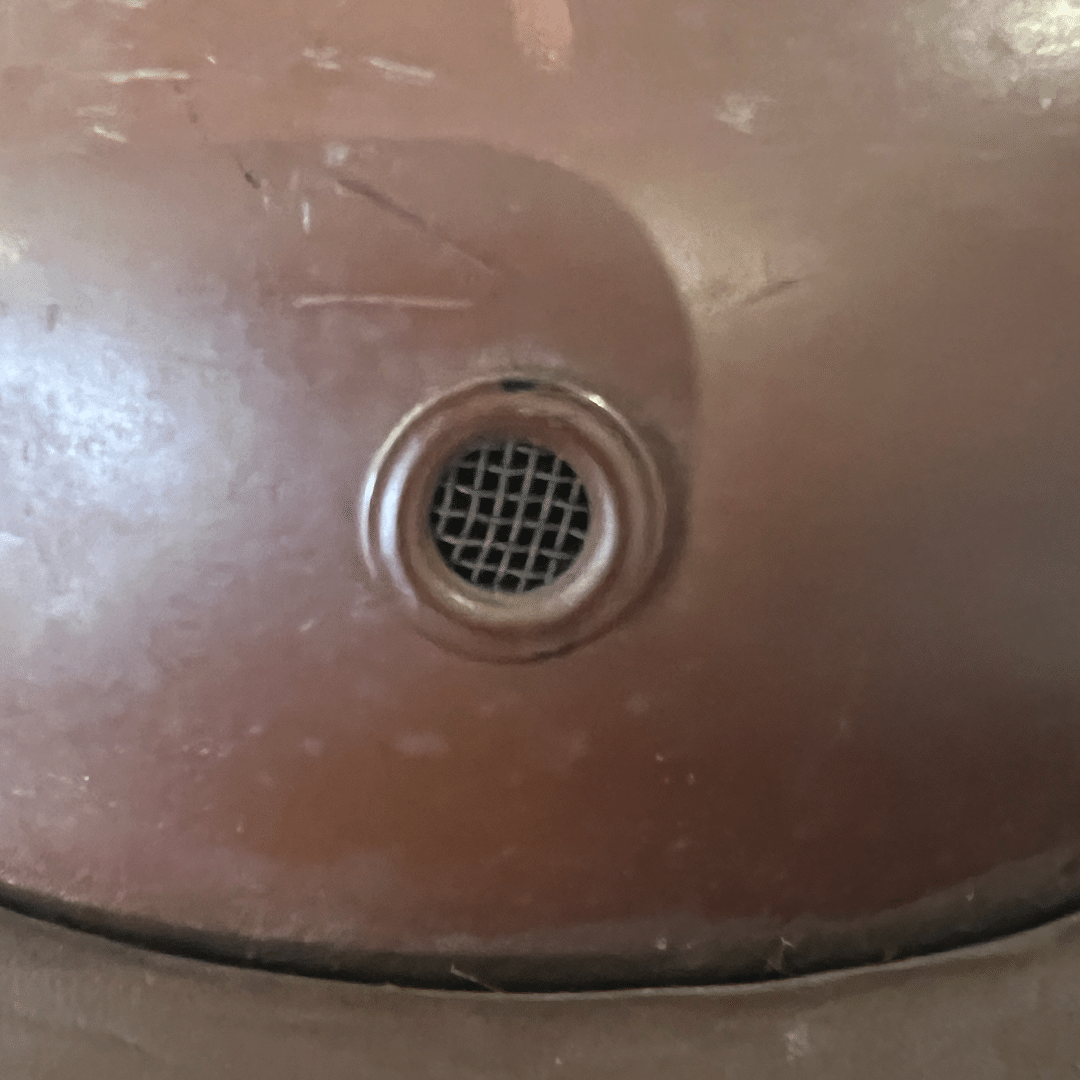 A close up of the air grill on a German WW2 Gendarmerie Police Motorcycle Helmet by Erel.