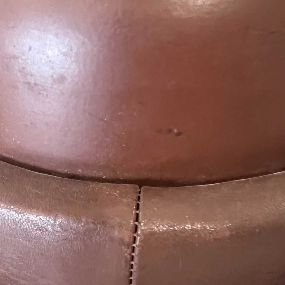 Exterior of a a genuine German WW2 Gendarmerie Police Motorcycle Helmet by Erel, in brown leather.