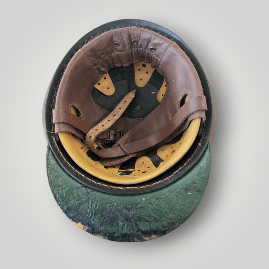 Interior photo of a German WW2 Gendarmerie Police Motorcycle Helmet by Erel, constructed in fibreglass and brown leather.
