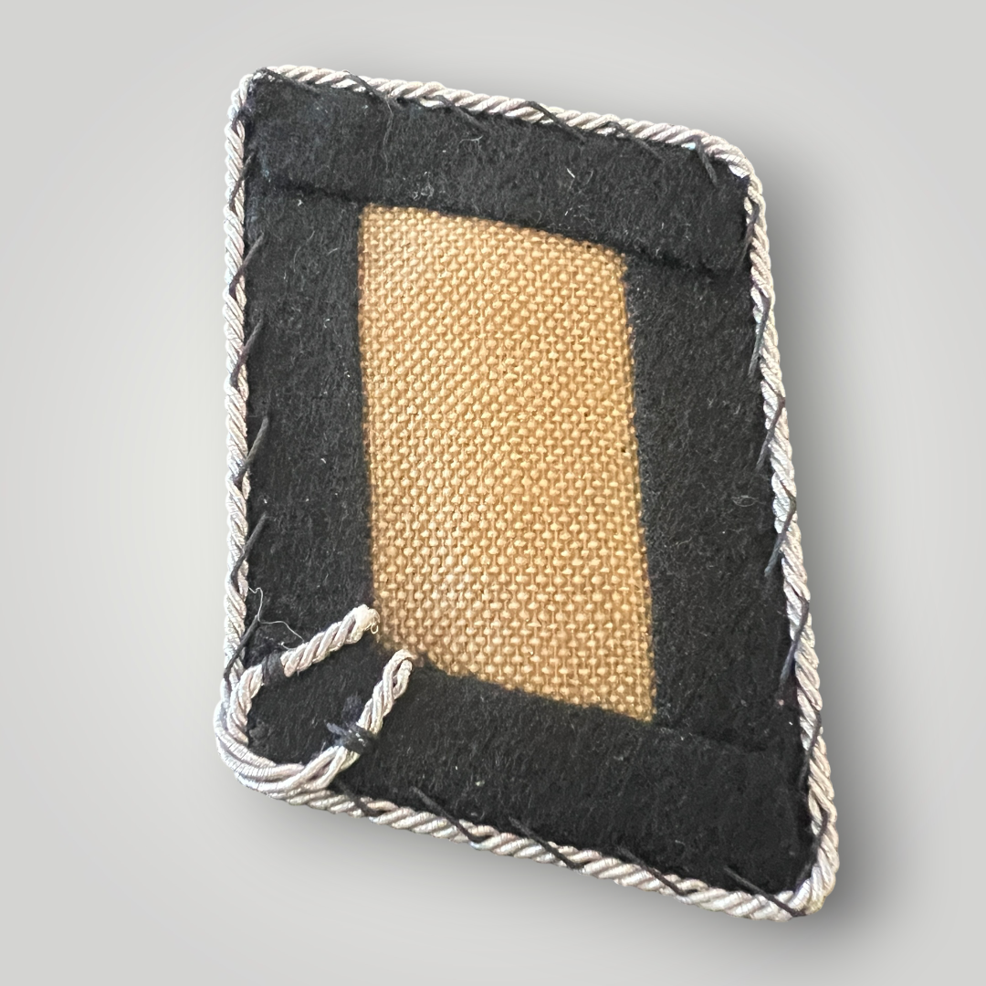 Reverse image of a scarce Waffen-SS 23rd SS Nederland Division officer’s collar tab, with buckram stiffener.